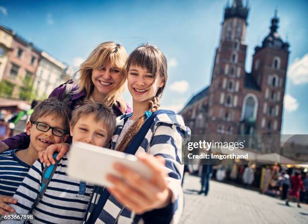 family visiting cracow, poland - daily life in krakow stock pictures, royalty-free photos & images