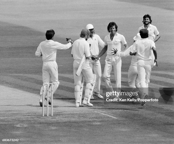Pakistan captain Imran Khan is congratulated on the wicket of England batsman David Capel during the 3rd Test match between England and Pakistan at...