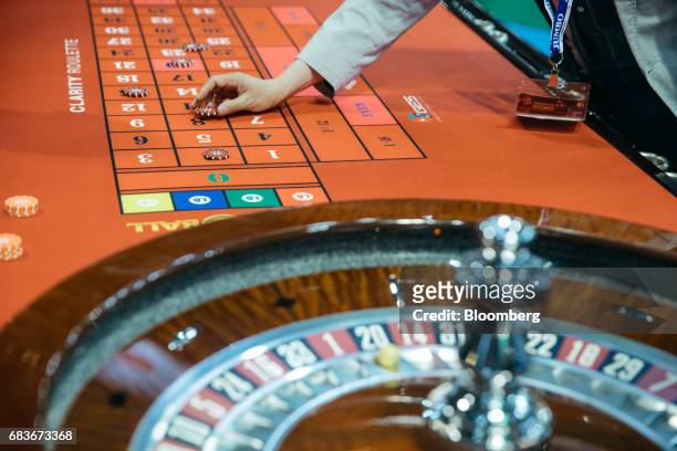 Gaming chips are placed on a roulette table at the Global Gaming Expo inside the Venetian Macau resort and casino, operated by Sands China Ltd., a...