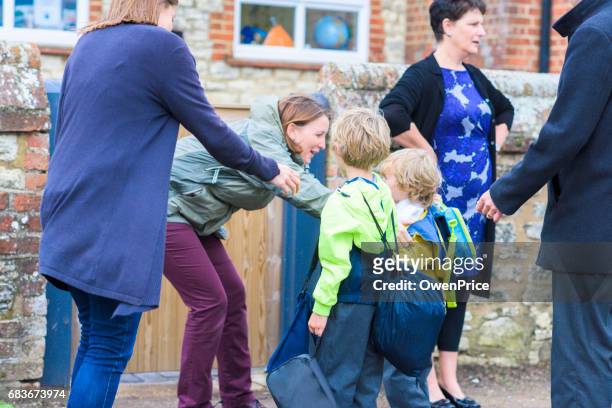 education uk primary school home time - parent school child stock pictures, royalty-free photos & images