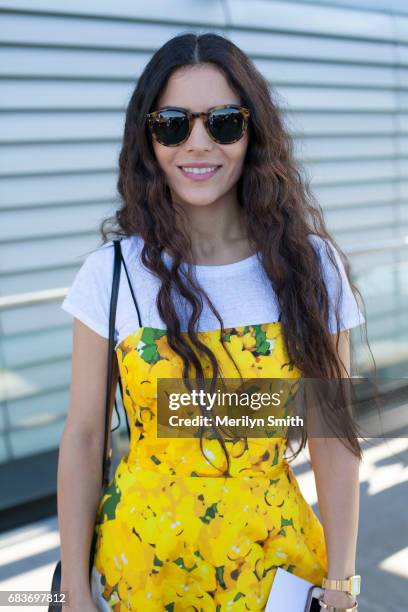 Media Professional Chrystelle Manor wearing a Lillian Khallouf dress and Ahlem sunglasses during Mercedes-Benz Fashion Week Resort 18 Collections at...