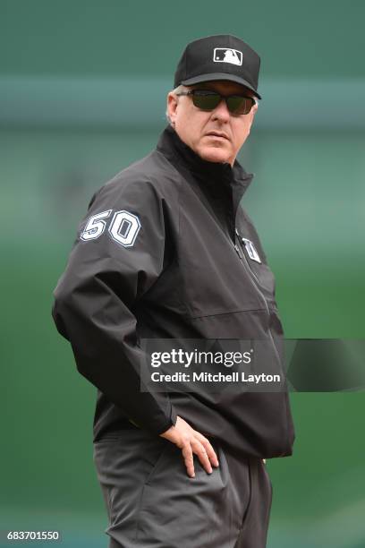 Umpire Paul Emmel looks on during a baseball game between the Washington Nationals and the Arizona Diamondbacks at Nationals Park on May 4, 2017 in...