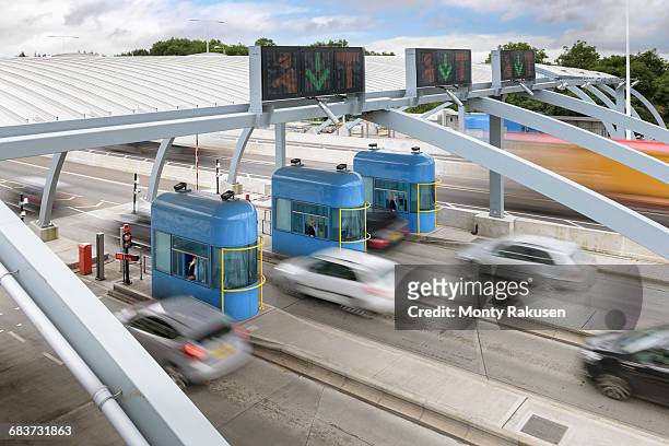 cars travelling through toll booth at bridge, high angle view - humber bridge stockfoto's en -beelden