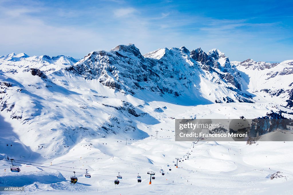 Snow covered mountain landscape and ski lift, Engelberg, Mount Titlis, Switzerland