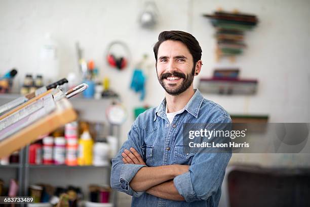 portrait of young male printer in printing press studio - textile printing stock pictures, royalty-free photos & images