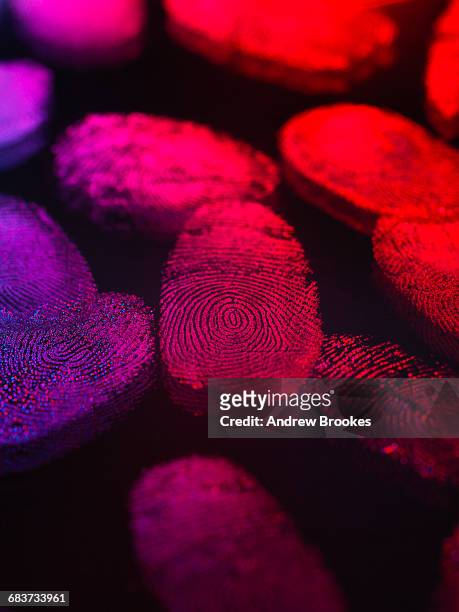 identity, human finger prints shown up using light - digital fingerprint stock pictures, royalty-free photos & images