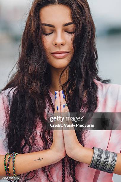 young woman with closed eyes practicing yoga in prayer position - namaste bildbanksfoton och bilder