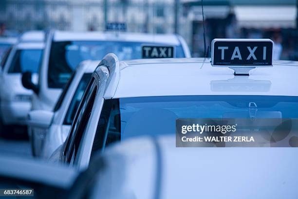 taxis in queue, piedmont, turin, italy - taxi van stockfoto's en -beelden
