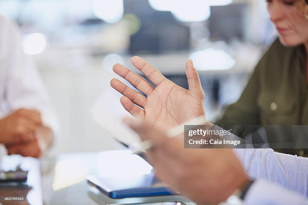 Hands of businessman gesturing in meeting