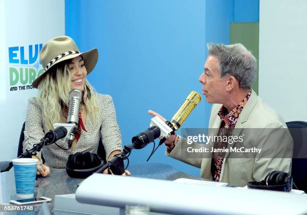 Miley Cyrus and host Elvis Duran during an interview on "The Elvis Duran Z100 Morning Show" at Z100 Studio on May 16, 2017 in New York City.