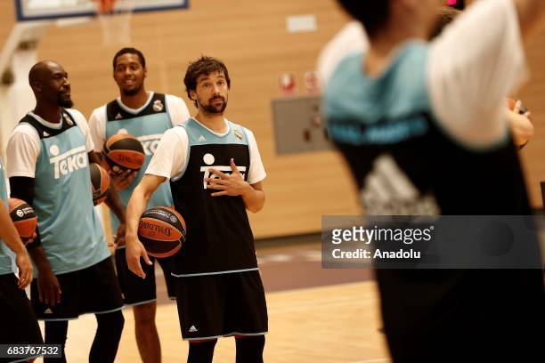 Sergio Llull , Trey Thompkins and Othello Hunter of Real Madrid attend a training session before a press conference as part of Media Day ahead of...