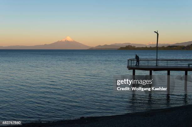 View of Lake Llanquihue and Mount Osorno at sunset from Puerto Varas in the Lake District near Puerto Montt, Chile.