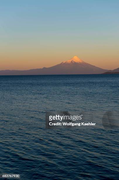 View of Lake Llanquihue and Mount Osorno at sunset from Puerto Varas in the Lake District near Puerto Montt, Chile.