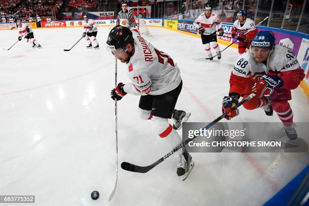 Czech Republic's forward David Pastrnak vies with Switzerland's forward Tanner Richard during the IIHF Men's World Championship group B ice hockey...