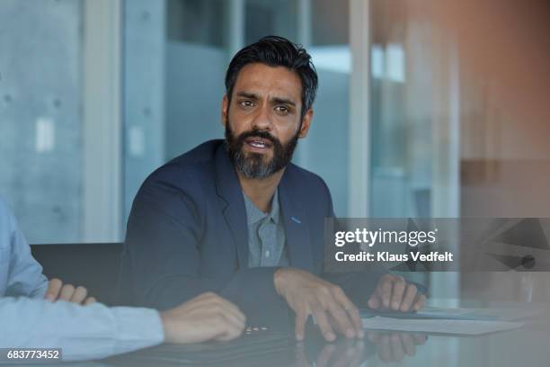 business people having discussions in meeting room - looking away stock-fotos und bilder