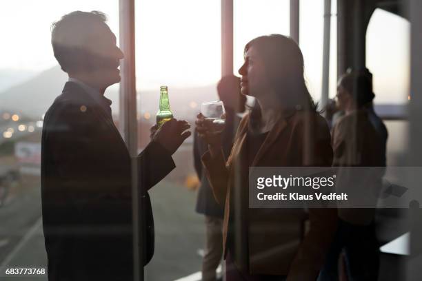 group of businesspeople having friday night drinks - office drinks stock pictures, royalty-free photos & images
