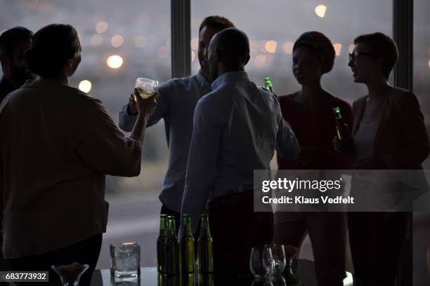 group of businesspeople having friday night drinks - male friends drinking beer stock pictures, royalty-free photos & images