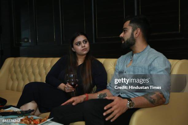 Cricketer Virat Kohli during special dinner for his Royal Challengers Bangalore teammates at his new restaurant Nueva, RK Puram on May 12, 2017 in...