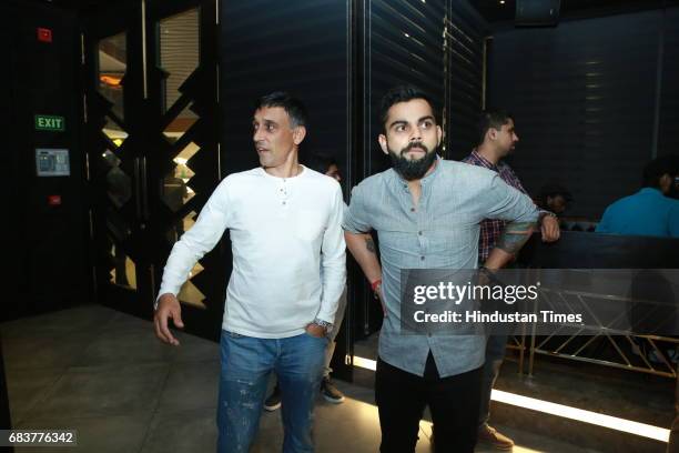 Cricketer Virat Kohli during special dinner for his Royal Challengers Bangalore teammates at his new restaurant Nueva, RK Puram on May 12, 2017 in...