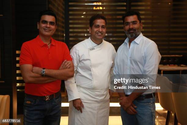 Chef Michael Swamy with Sharad and Vikrant Batra during special dinner for Royal Challengers Bangalore teammates by Virat Kohli at his new restaurant...