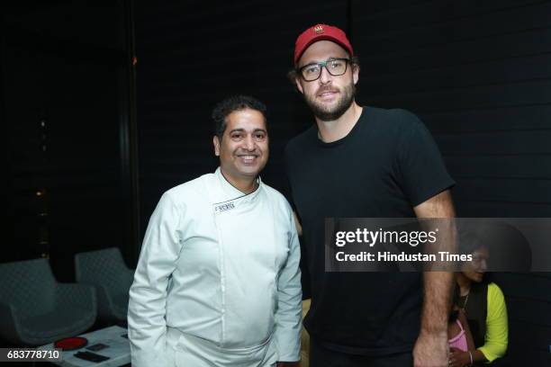 Chef Michael Swamy with cricketer Daniel Vettori during special dinner for Royal Challengers Bangalore teammates by Virat Kohli at his new restaurant...