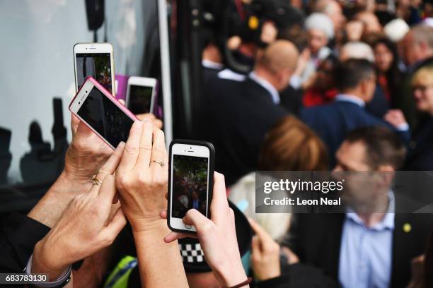 Supporters use their mobile phones to take photographers of leader of the Labour Party Jeremy Corbyn as he attends a campaign rally in Beaumont Park...