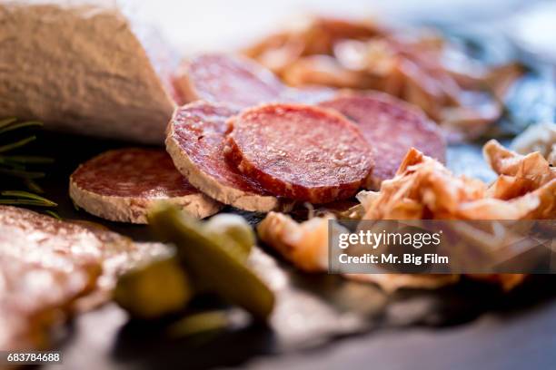 cured meats charcuterie on a slate tray - fresh meat film stock pictures, royalty-free photos & images