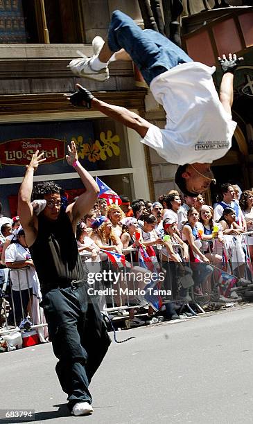 Members of the Central Islip High School Spanish Club Dancers and Tumblers perform during the Puerto Rican Day Parade June 9, 2002 in New York City....