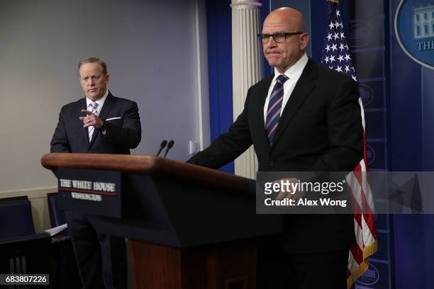 White House Press Secretary Sean Spicer takes question as National Security Advisor H.R. McMaster listens during press briefing at the James Brady...