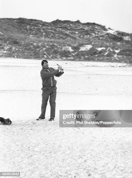 Golf writer and course designer, Donald Steel, in action during the President's Putter competition at Rye, in England, 8th January 1982.