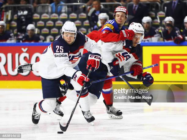 Anders Lee of the USA is smashed by Vladislav Namestnikov of Russia during the Russia v USA 2017 IIHF Ice Hockey World Championship match at Lanxess...