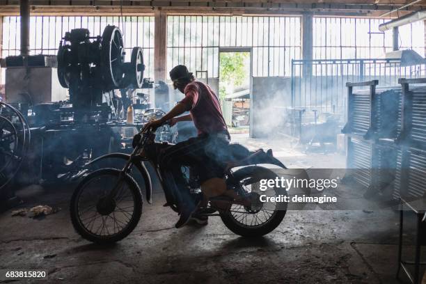 mam mechanic testing motorbike - motorcycle workshop stock pictures, royalty-free photos & images