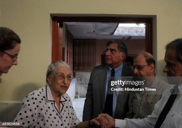 Funeral - Ratan Tata alongside Tata employees during the cremation of Jamshed Jehangir Bhabha at Chandanwadi crematorium on Wednesday.