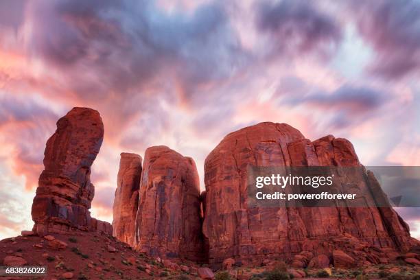 the thumb and camel butte in monument valley, arizona, usa - butte rocky outcrop stock pictures, royalty-free photos & images