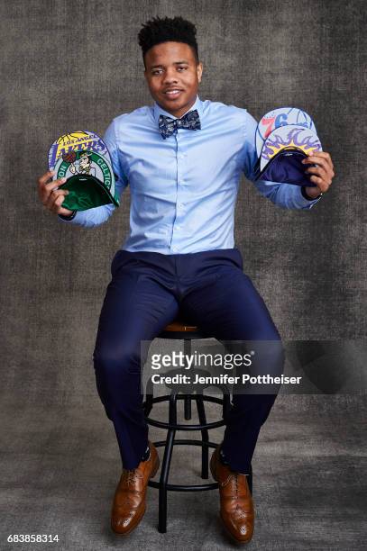 Draft prospect Markelle Fultz poses poses with draft caps for portraits prior to the 2017 NBA Draft Lottery at the NBA Headquarters in New York, New...