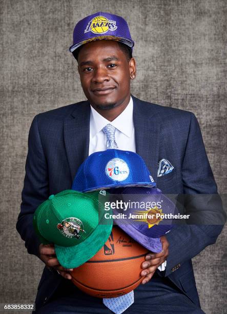 Draft prospect Josh Jackson poses poses with draft caps for portraits prior to the 2017 NBA Draft Lottery at the NBA Headquarters in New York, New...