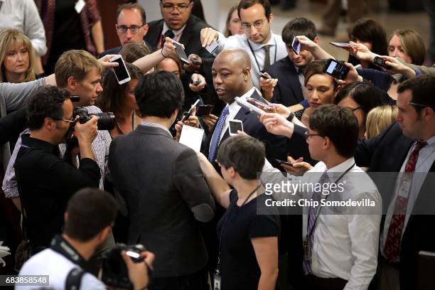Sen. Tim Scott is surrounded by reporters as he heads for his party's weekly policy luncheon at the U.S. Capitol May 16, 2017 in Washington, DC. Many...