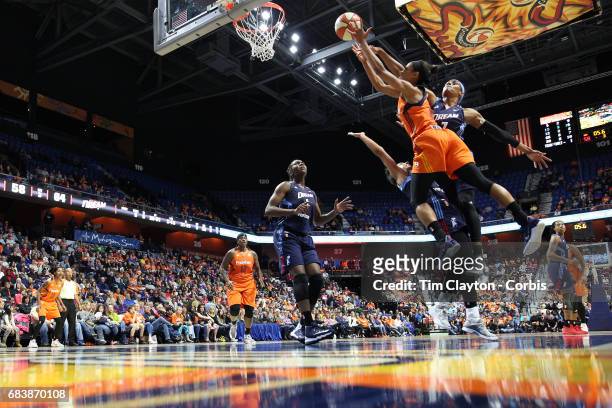 May 13: Guard Jasmine Thomas of the Connecticut Sun commits an offensive foul on guard Brianna Kiesel of the Atlanta Dream as she drives to the...