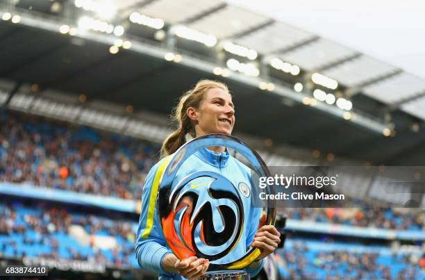 Karren Bardsley of Manchester City laddies team presents the Women's Super League 1 trophy to the Manchester City fans prior to the Premier League...