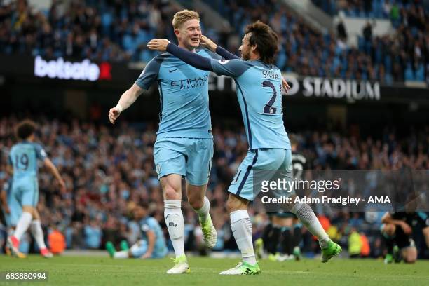 Kevin De Bruyne of Manchester City celebrates with David Silva after scoring a goal to make it 2-0 during the Premier League match between Manchester...