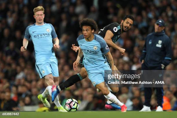 Leroy Sane of Manchester City competes with Nacer Chadli of West Bromwich Albion during the Premier League match between Manchester City and West...