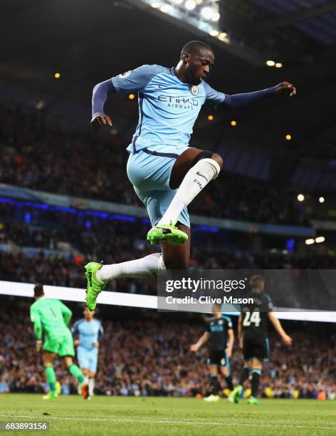 Yaya Toure of Manchester City celebrates scoring his sides third goal during the Premier League match between Manchester City and West Bromwich...