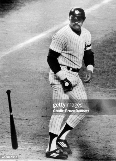 Reggie Jackson of the New York Yankees throws his bat after striking out during Game 3 of the 1980 American League Championship Series against the...
