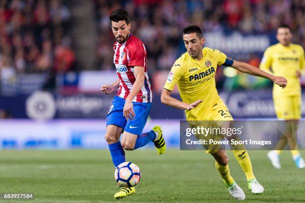 Nicolas Gaitan of Atletico de Madrid fights for the ball with Bruno Soriano Llido of Villarreal CF during the La Liga match between Atletico de...