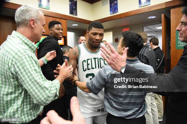 Marcus Smart of the Boston Celtics celebrates their victory against the Washington Wizards during Game Seven of the Eastern Conference Semifinals of...