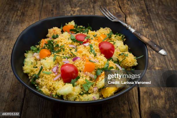couscous salad with tomato, parsley, cucumber ans red onions - larissa veronesi bildbanksfoton och bilder