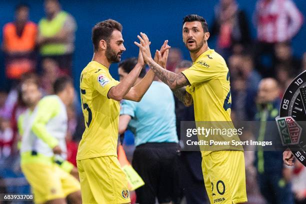 Bojan Jokic and Roberto Soriano of Villarreal CF and during the La Liga match between Atletico de Madrid vs Villarreal CF at the Estadio Vicente...