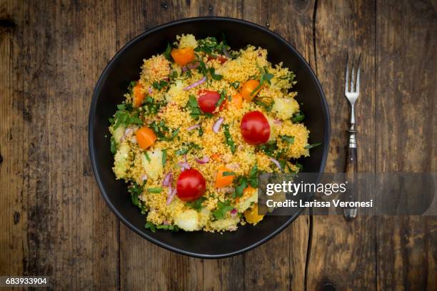 couscous salad with tomato, parsley, cucumber ans red onions - larissa veronesi bildbanksfoton och bilder