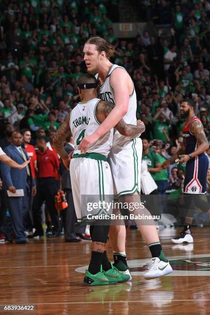 Kelly Olynyk and Isaiah Thomas of the Boston Celtics celebrate during Game Seven of the Eastern Conference Semifinals of the 2017 NBA Playoffs on May...