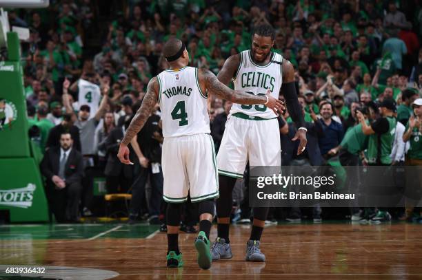 Isaiah Thomas and Jae Crowder of the Boston Celtics celebrate during Game Seven of the Eastern Conference Semifinals of the 2017 NBA Playoffs on May...